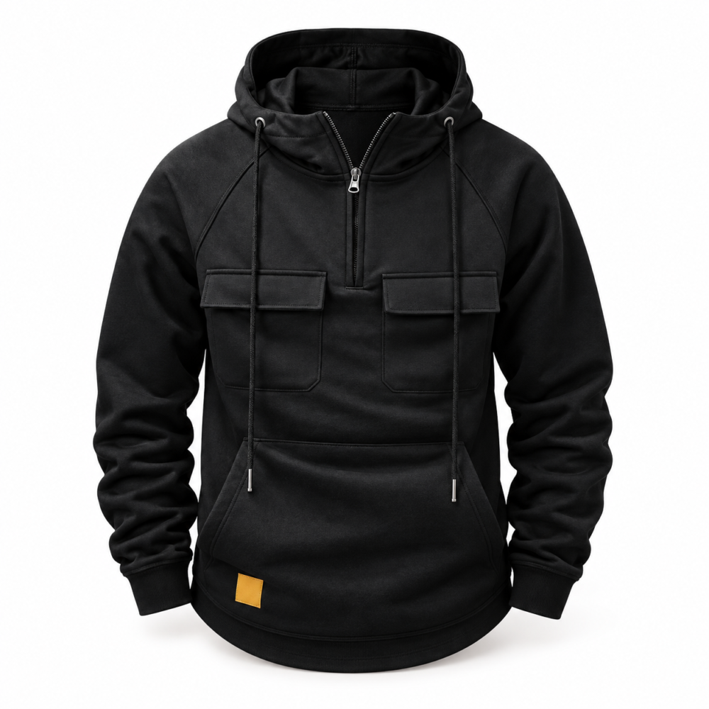 Black half-zip hoodie with chest flap pockets, drawstring hood and small mustard-yellow lower patch