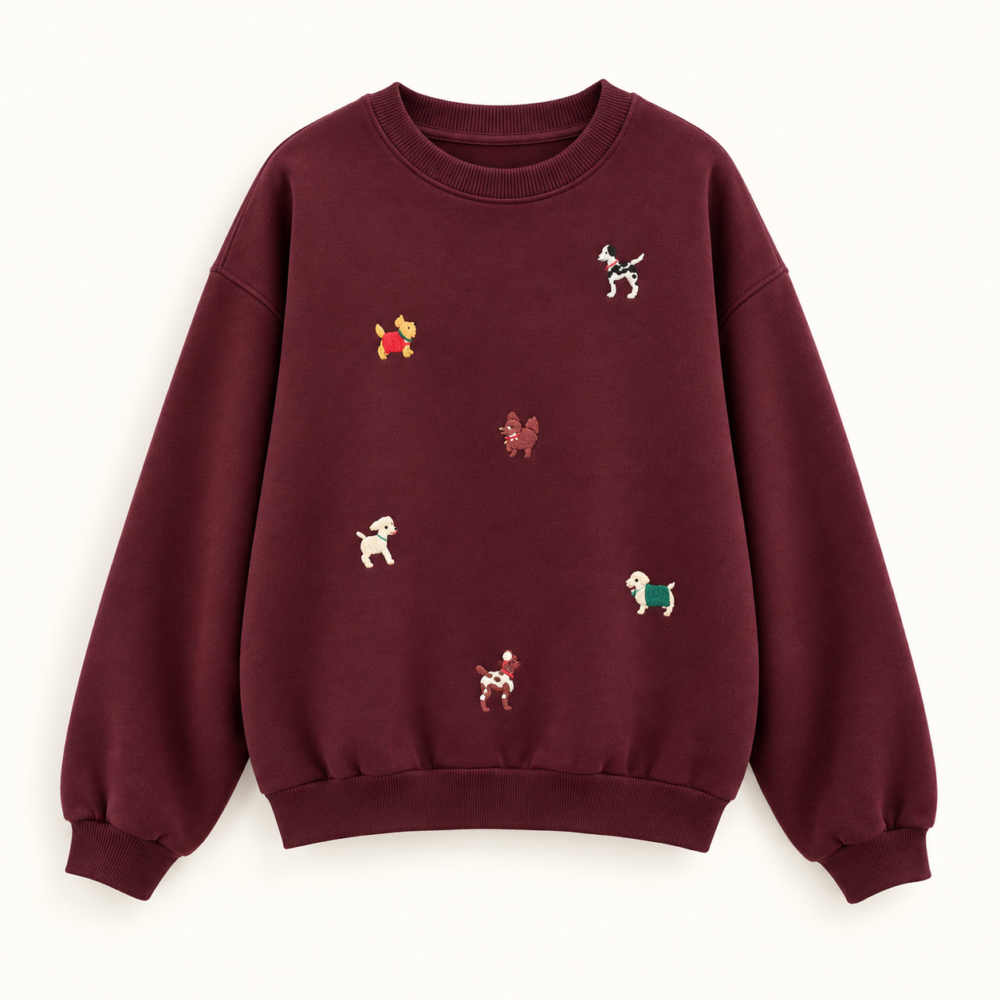 Burgundy crewneck sweatshirt with six small scattered dog motifs and ribbed cuffs and hem