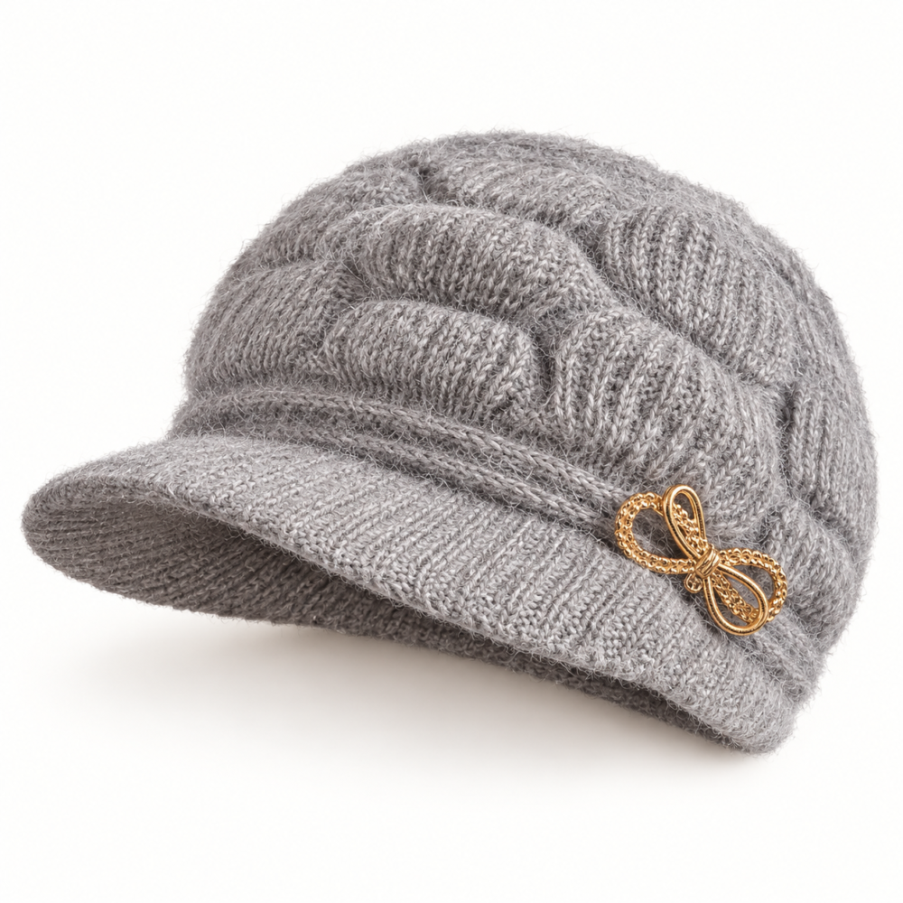 Gray fuzzy short-brim cable-knit hat with a gold-tone bow ornament